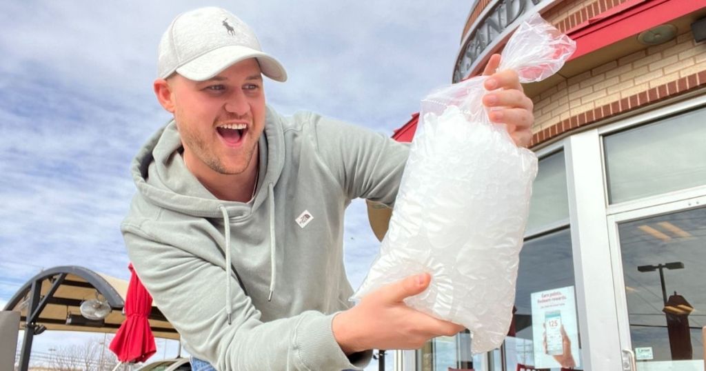 man holding a bag of ice