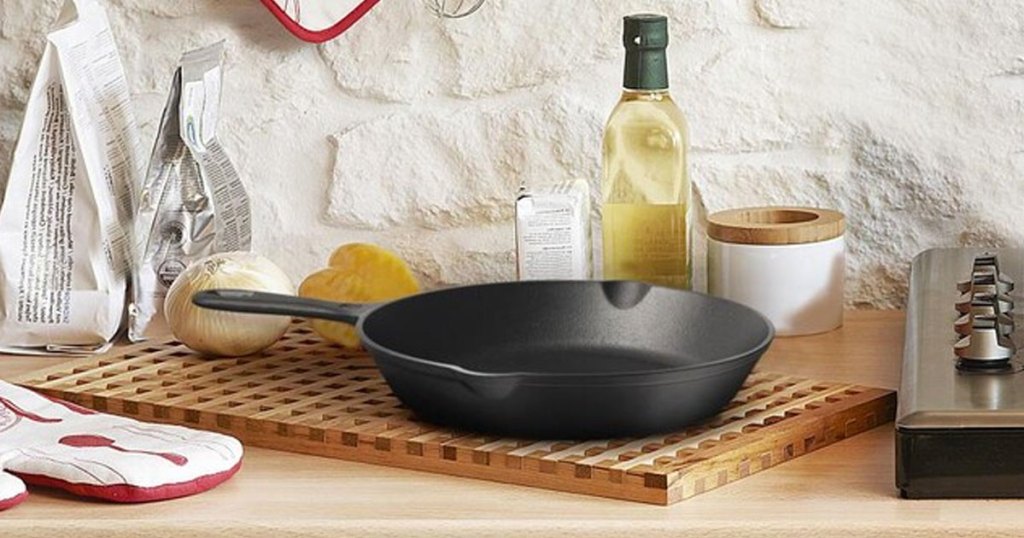 cast iron pan on a cutting board