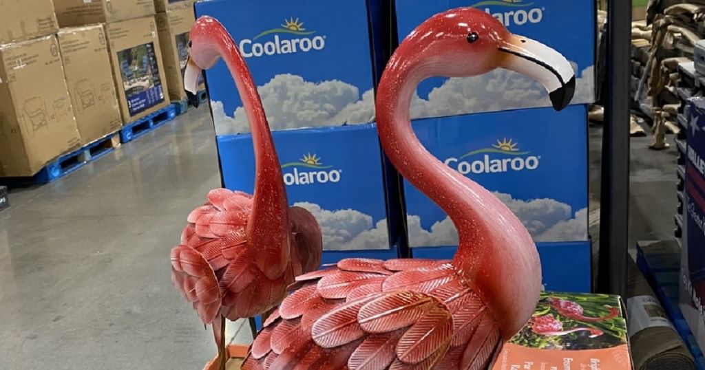 two metal flamingo statues