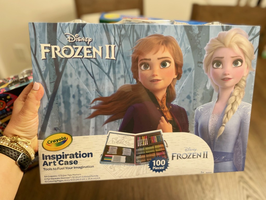 woman's hand holding Frozen 2 art set