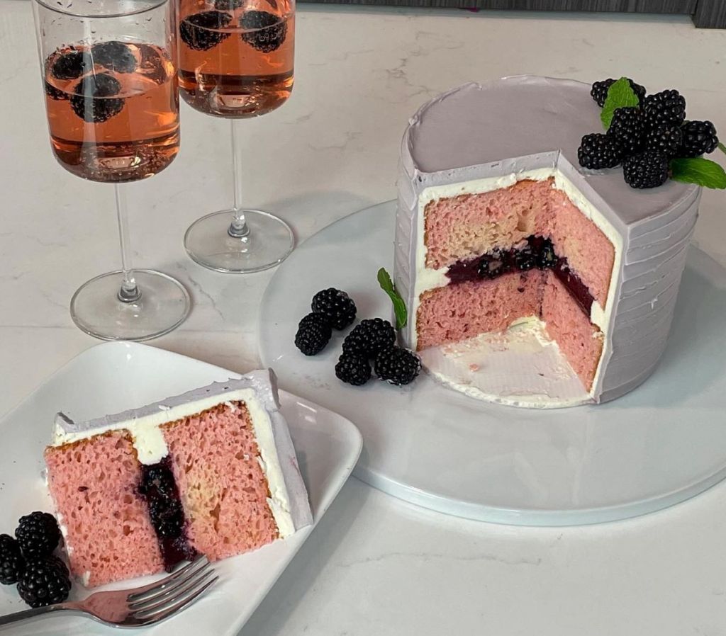 layered cake next to slice of cake on a plate