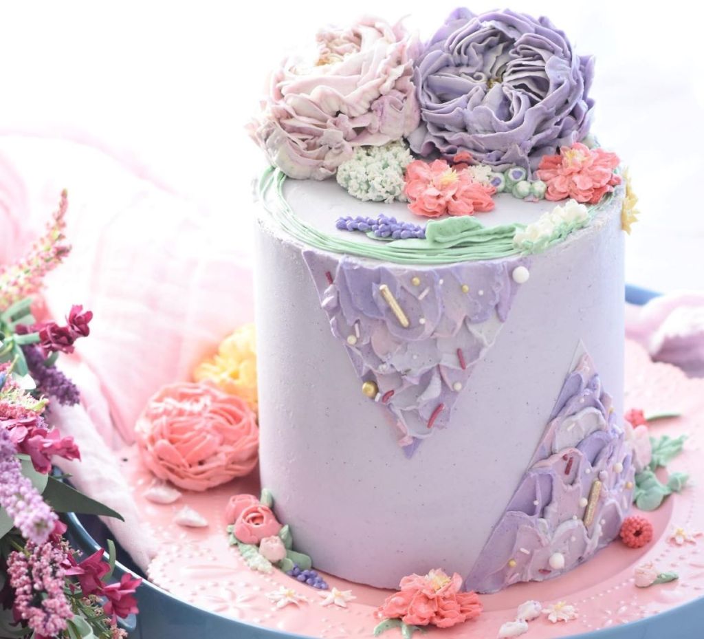 cake with flowers and sprinkles on it