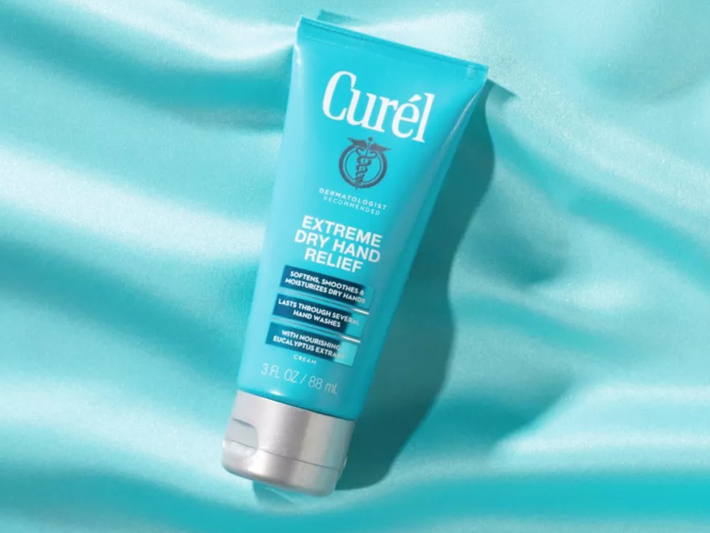 blue bottle of Curél Extreme Dry Hand Cream on blue background