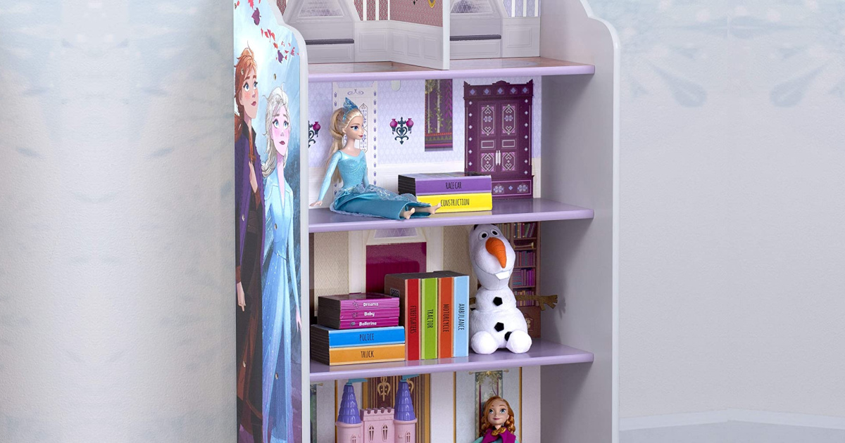 Disney Frozen themed bookcase with books and frozen dolls and plush sitting inside.
