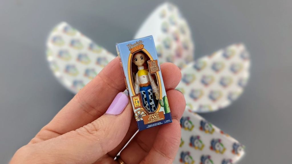 hand holding a Disney Mini Brands mini Jessie toy