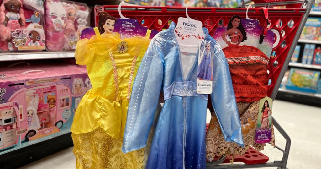 pretend princess dresses hanging on red cart 