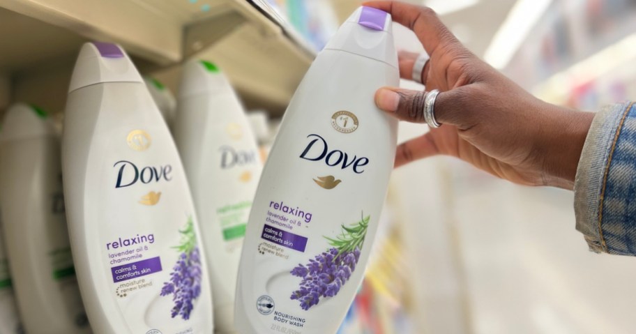hand pulling Dove Body Wash off shelf
