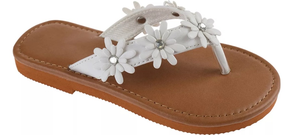 tan and white sandals with flowers on the straps