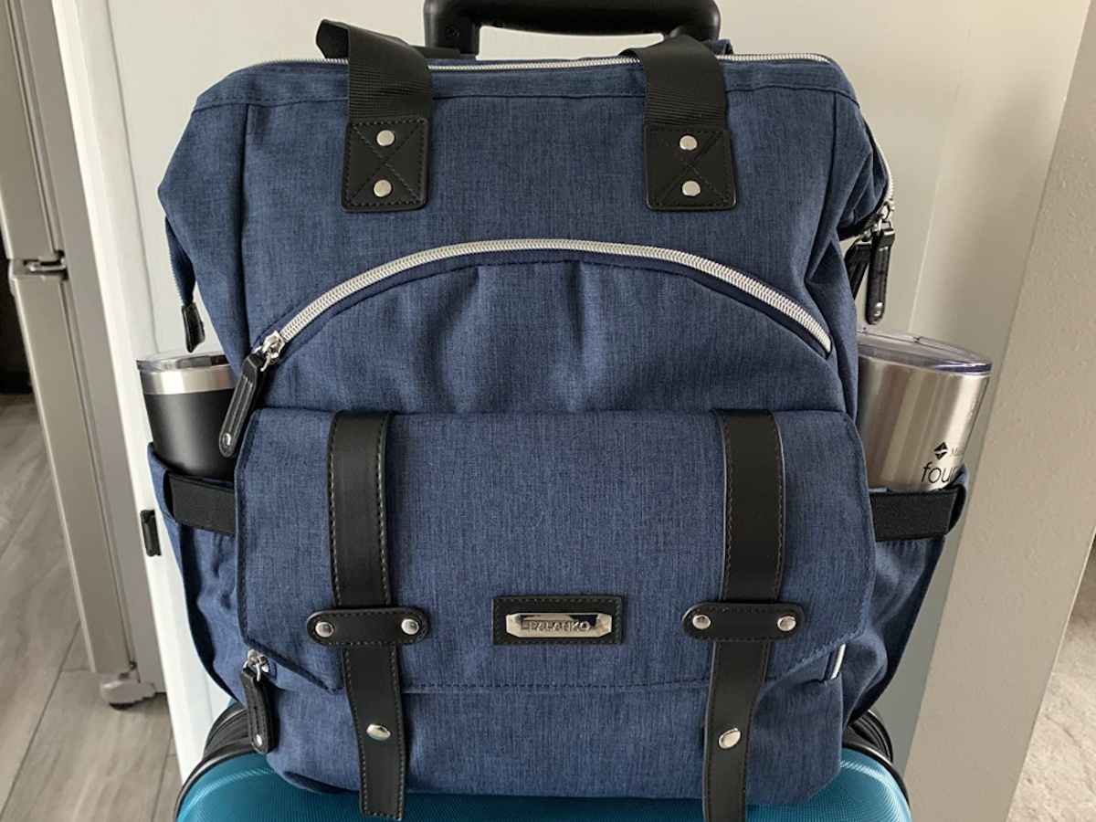 blue laptop and book bag