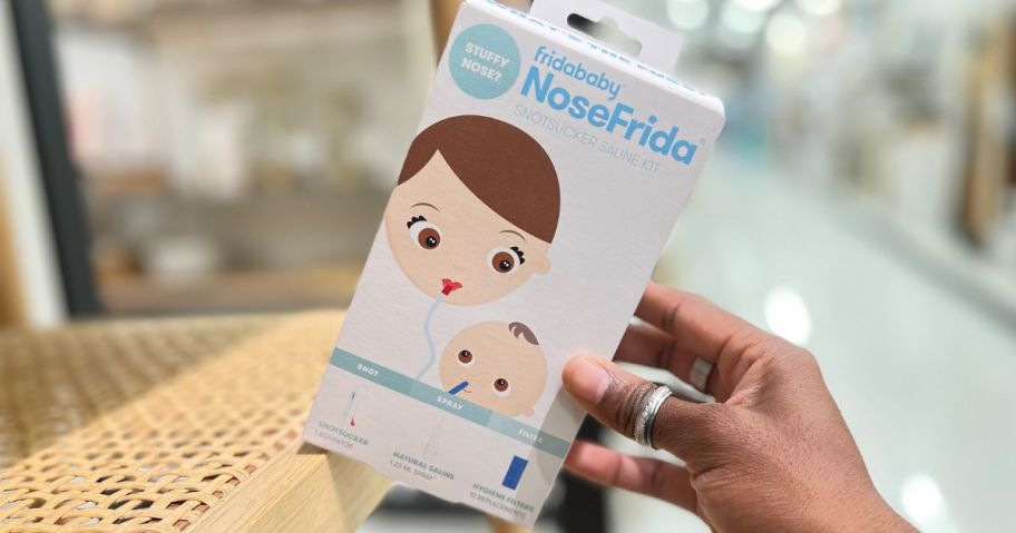 hand holding a Fridaybaby Nose Frida