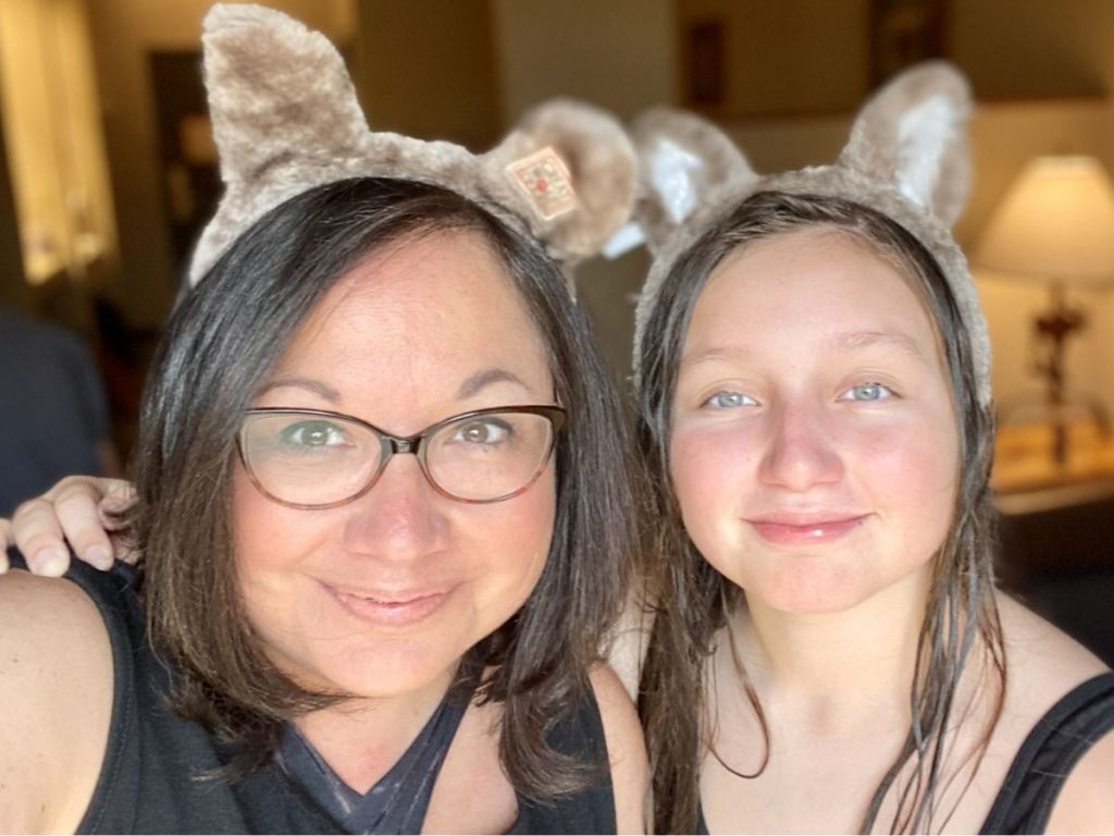 a woman and a teenage girl wearing wolf ears on their head