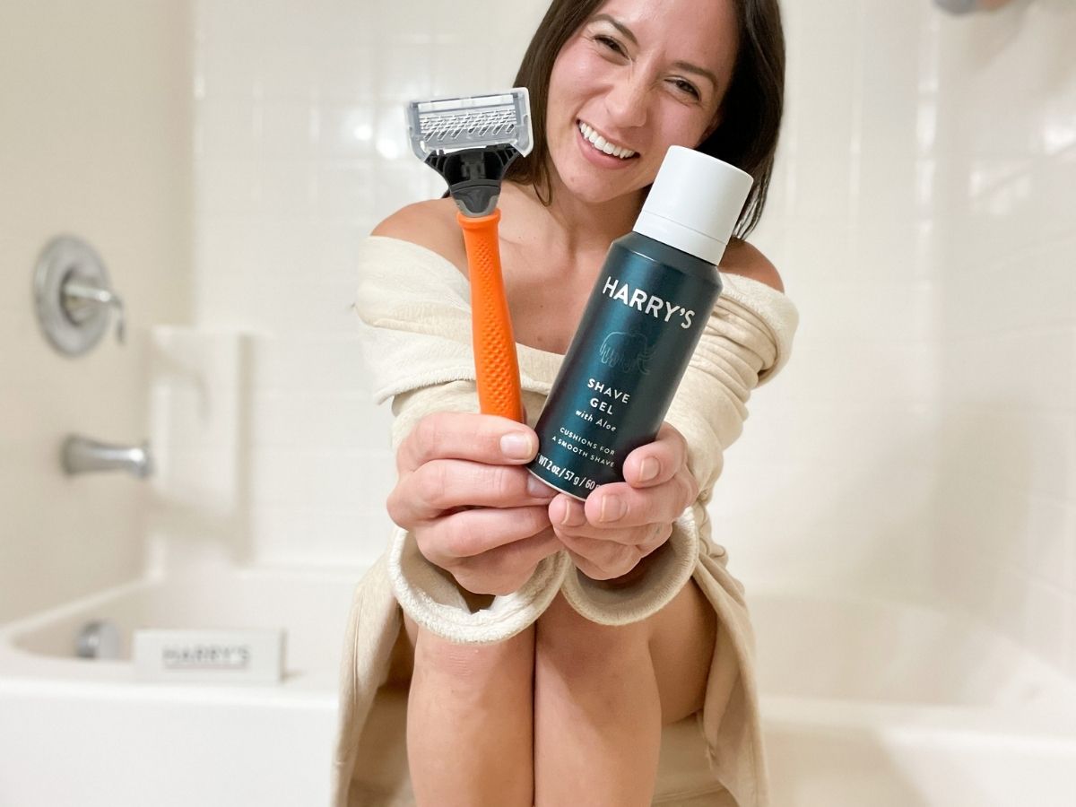 woman holding Harry's razor and shaving cream
