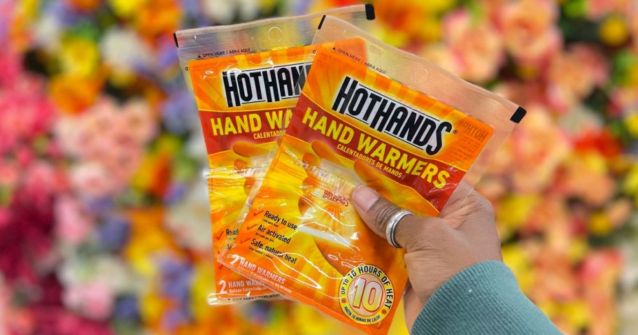 hand holding two packs of HotHands