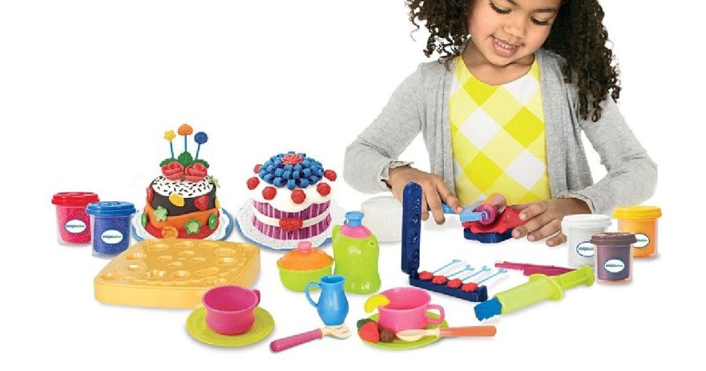 girl playing with baking toy set