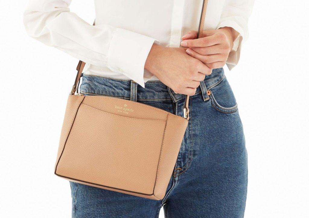 woman with brown kate spade crossbody