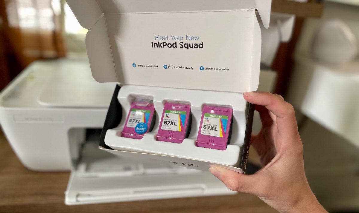 Hand holding a box of LD Brand Ink Cartridges