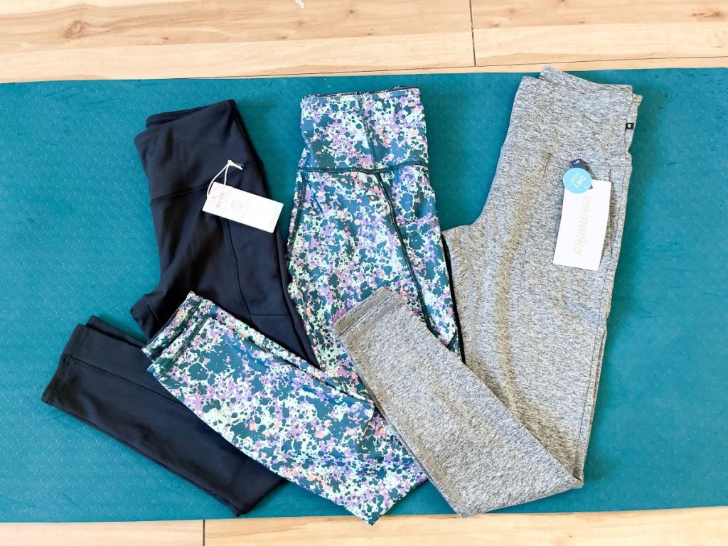 three pairs of leggings on a mat