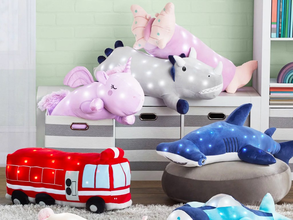 large light up animal pillows piled in playroom