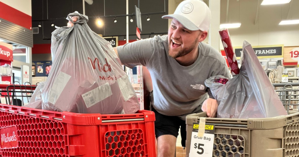 man with clearance grab bags in store carts