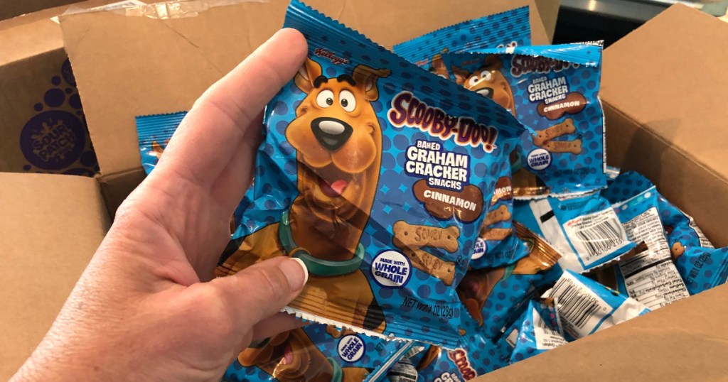 Scooby Doo Snacks in hand with more in box