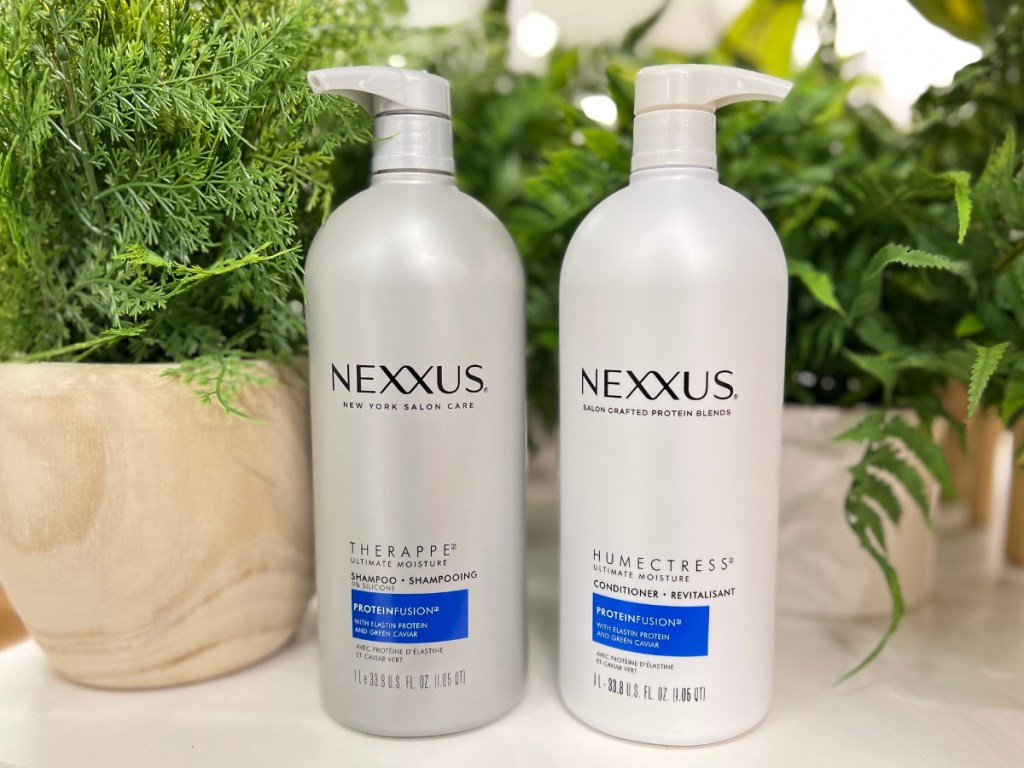 Nexxus Shampoo & Conditioner next to plants