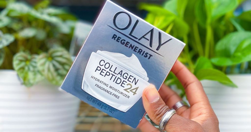 hand holding a box of Olay Regenerist Collagen Peptide