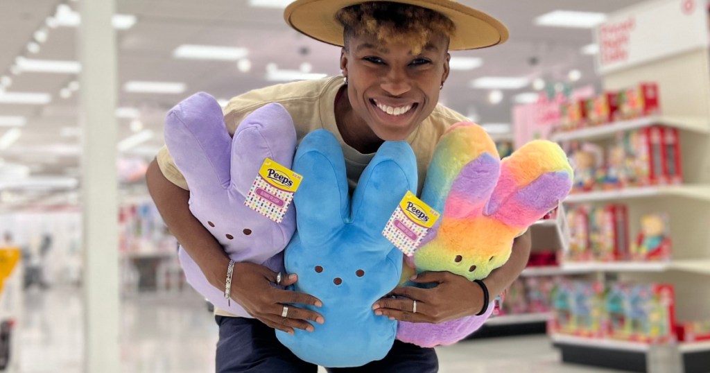 woman holding three large Peeps blush bunnies