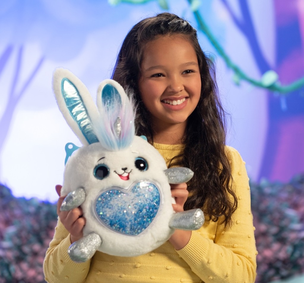 girl holding a plush bunny