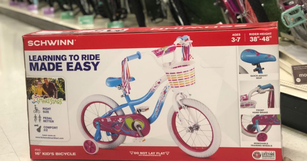 kids bike in box on floor at store 