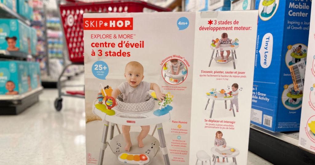 box with baby in play stand on front 