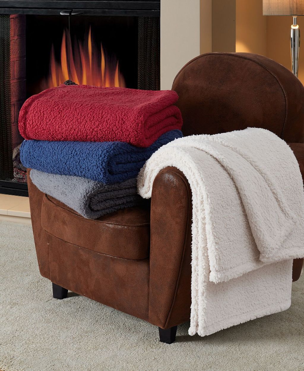 Solid Sherpa Throw on an arm chair