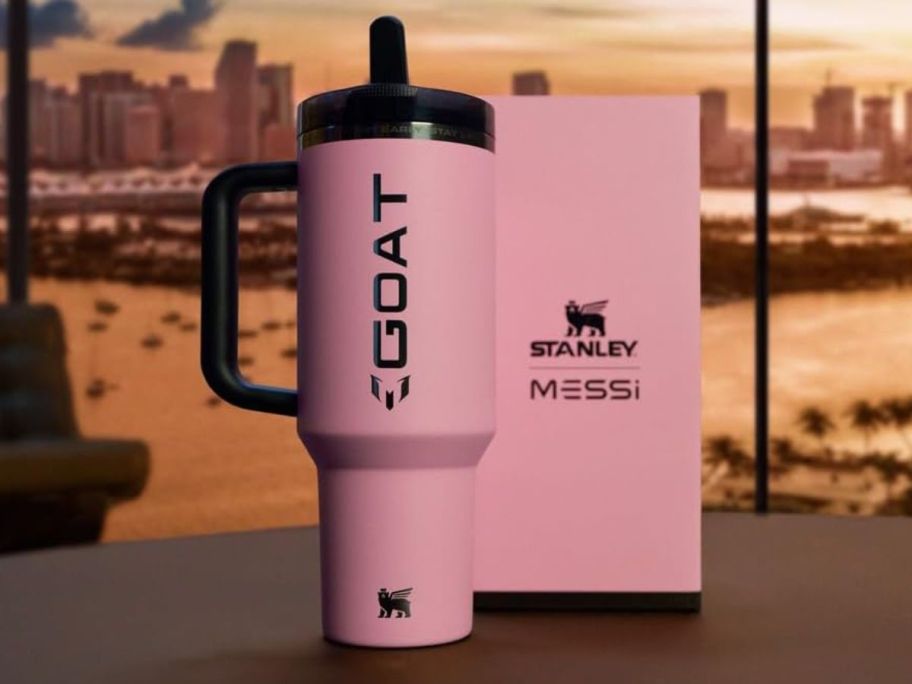 A pink Stanley x Messi Tumbler with GOAT printed on the side