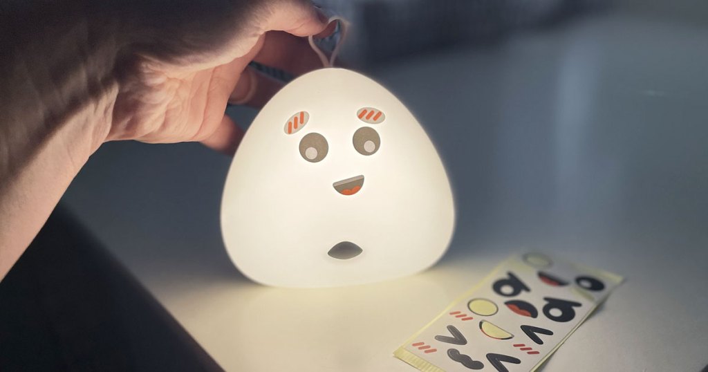 holding led nightlight with stickers