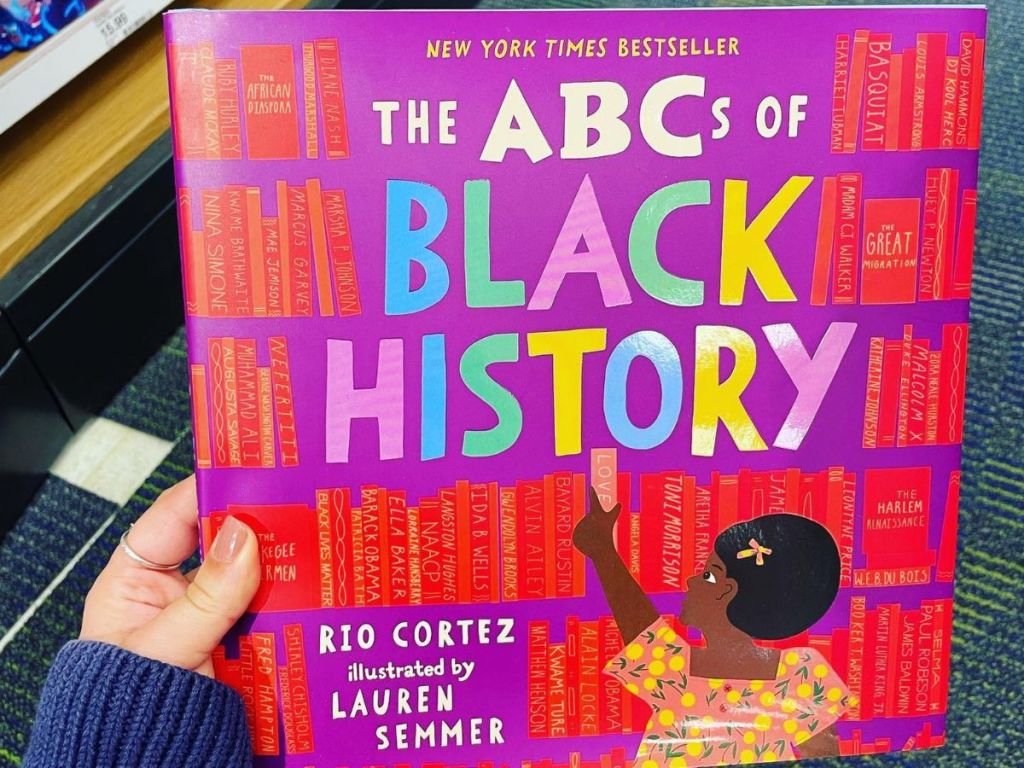 hand holding the The ABCs of Black History book