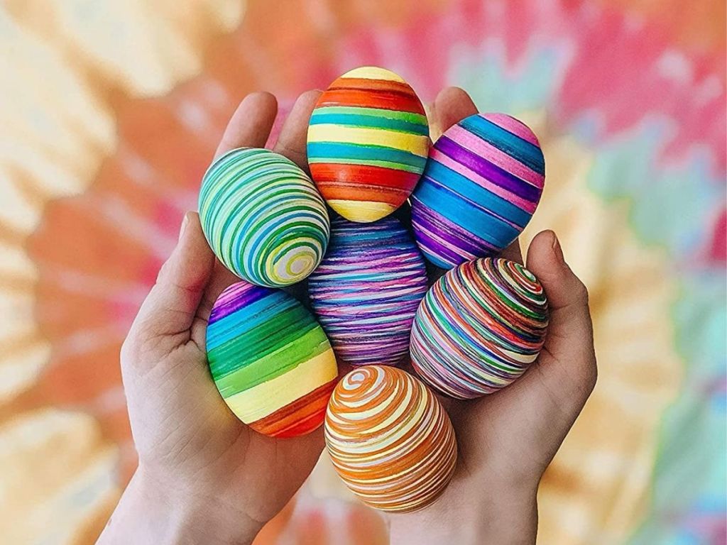 hand holding decorated Easter eggs