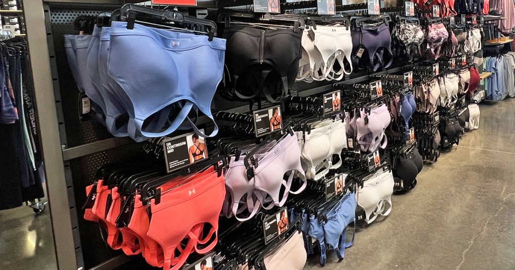 display of under armour sports bras in store