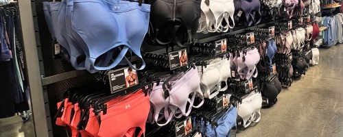 display of under armour sports bras in store