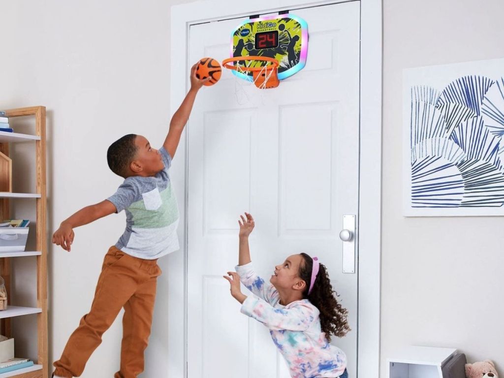 kids playing with over-the-door basketball hoop
