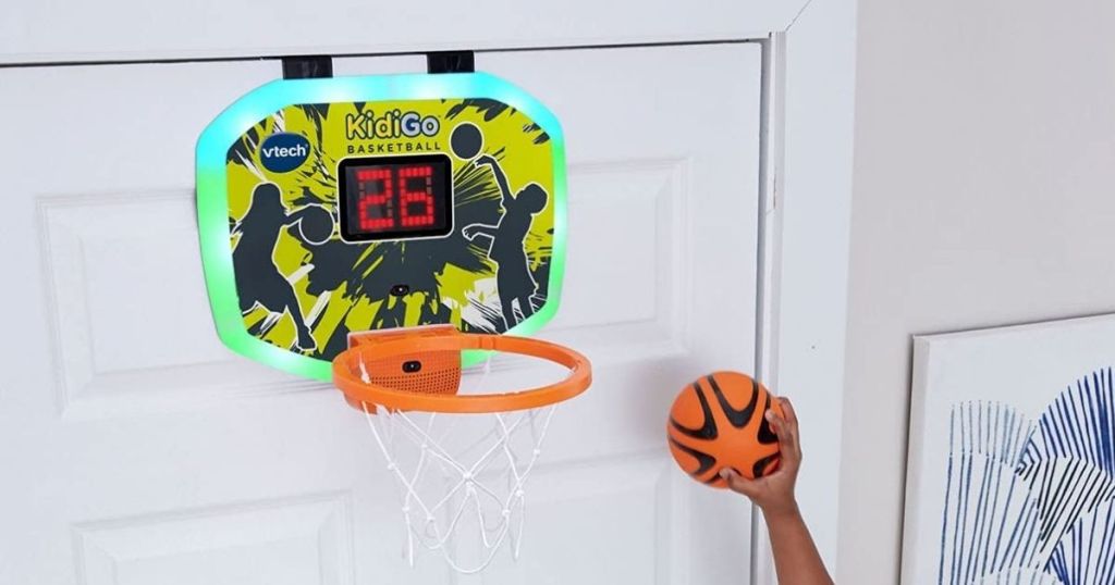 kid playing with over-the-door basketball hoop