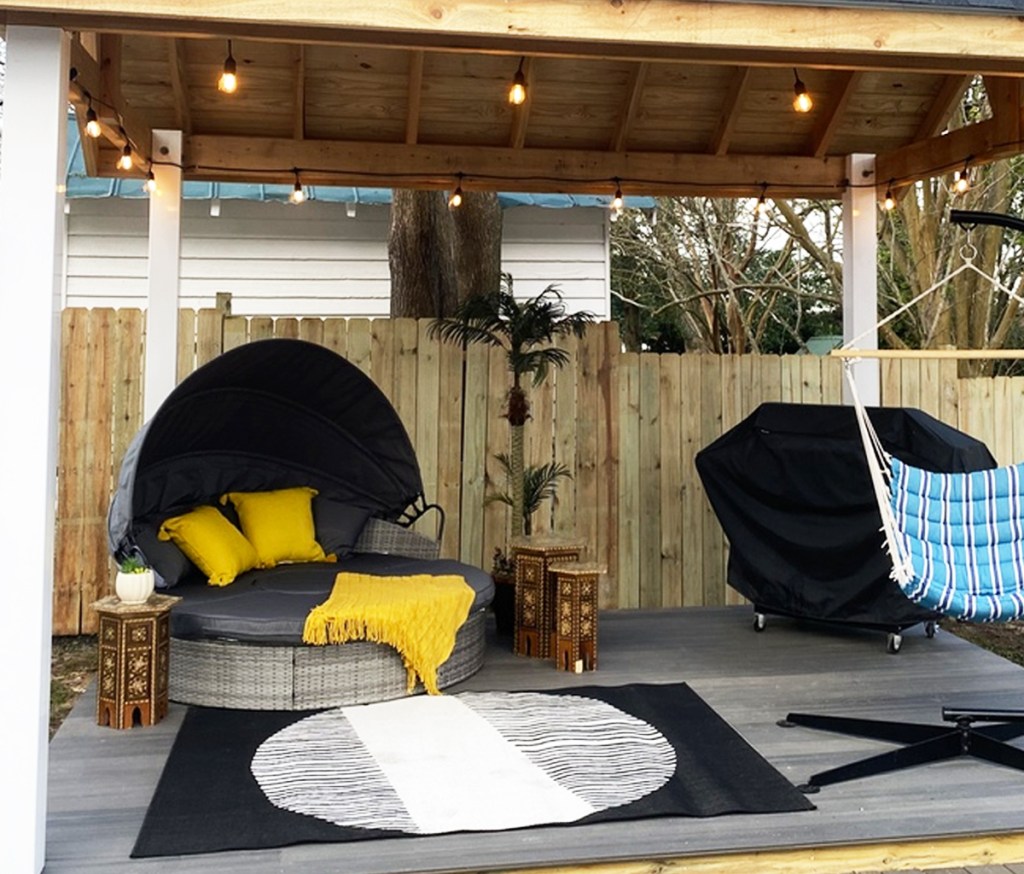 patio with daybed sectional, hammock chair, and bbq