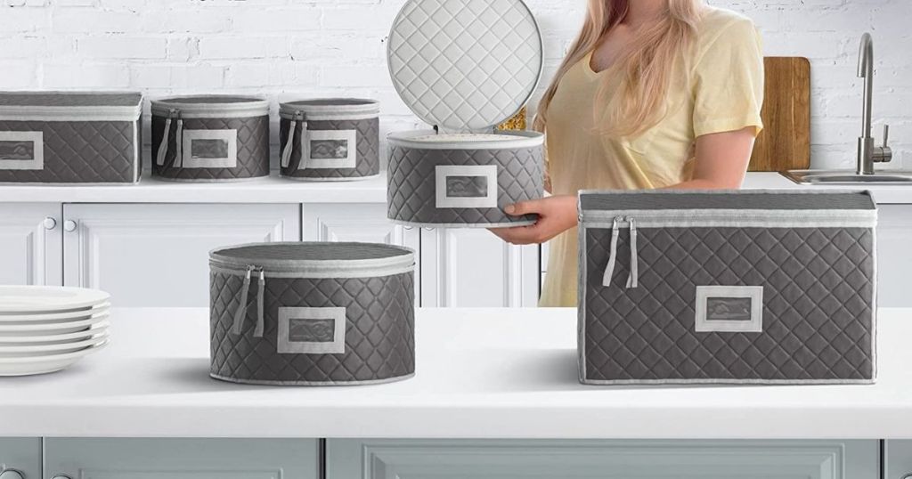 woman holding quilted storage boxes