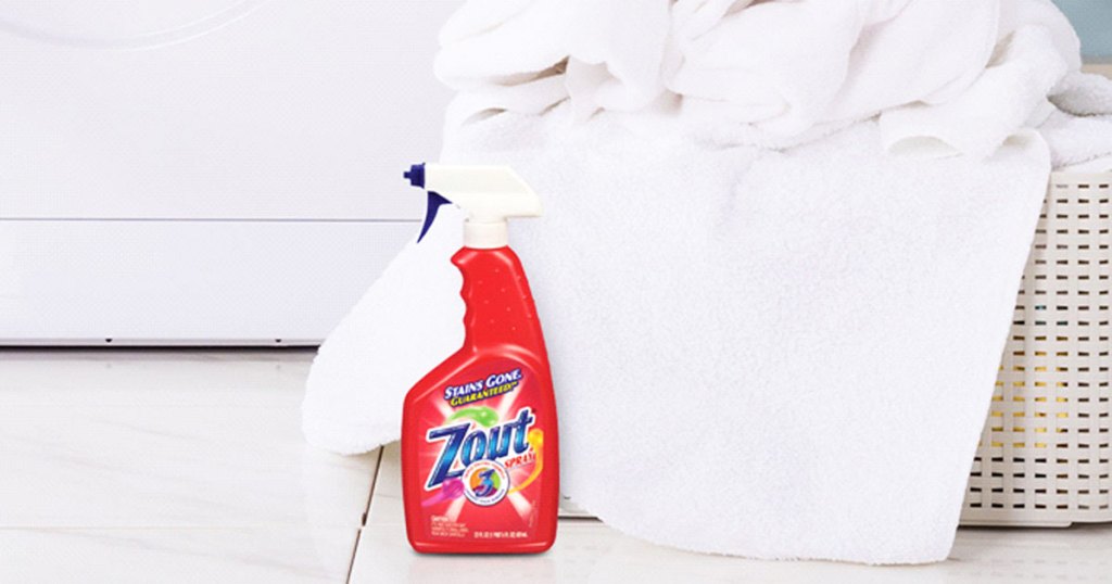 zout spray in front of basket of laundry