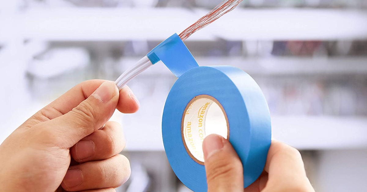 man holding amazoncommerical blue electrical tape and wire