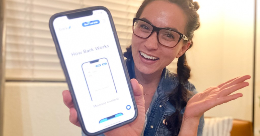 woman showing bark app on phone