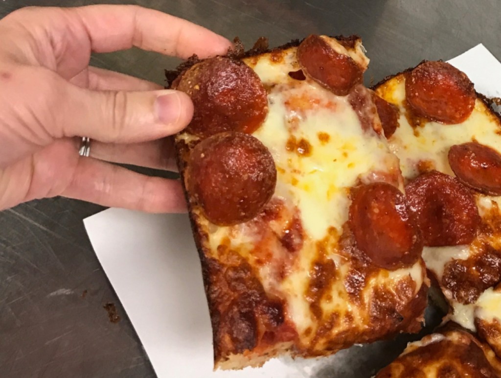 lifting a rectangular piece of pizza