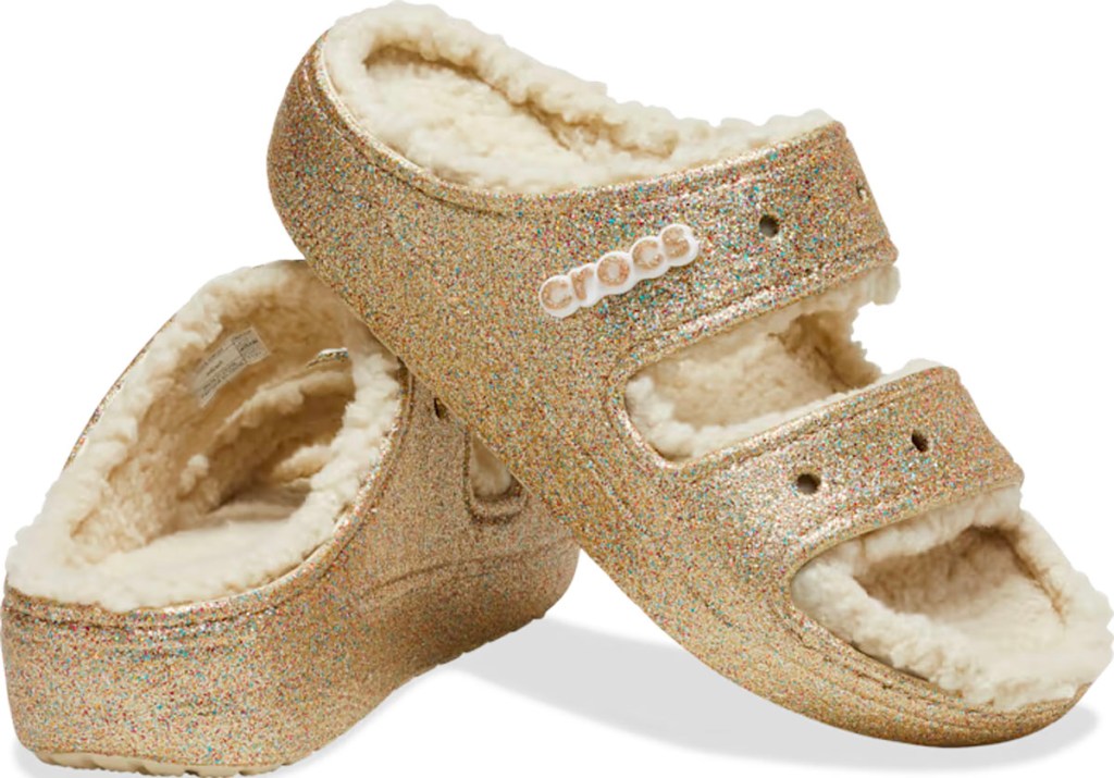 gold glitter crocs sandals stock image