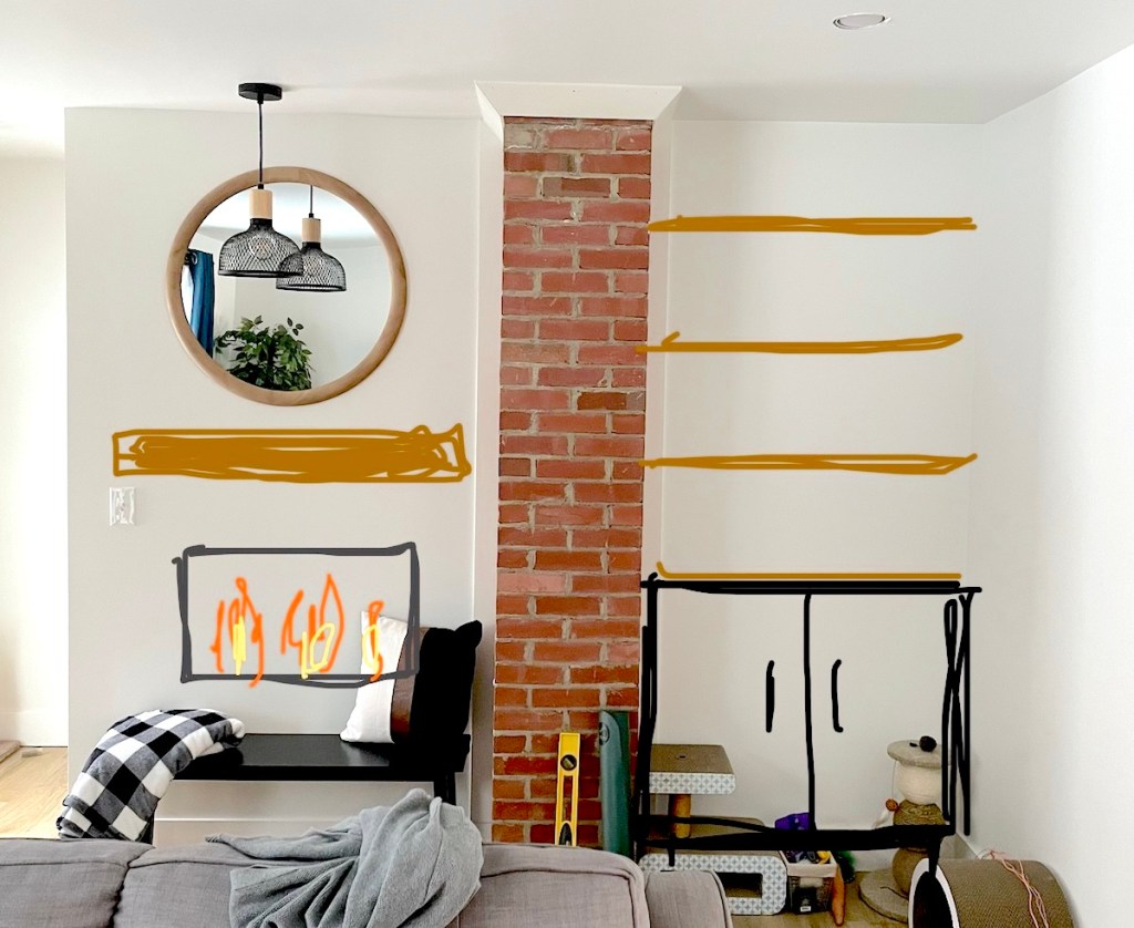 living room with exposed brick and mirror with project drawings