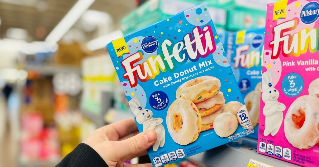 taking a box of Funfetti donuts off the shelf