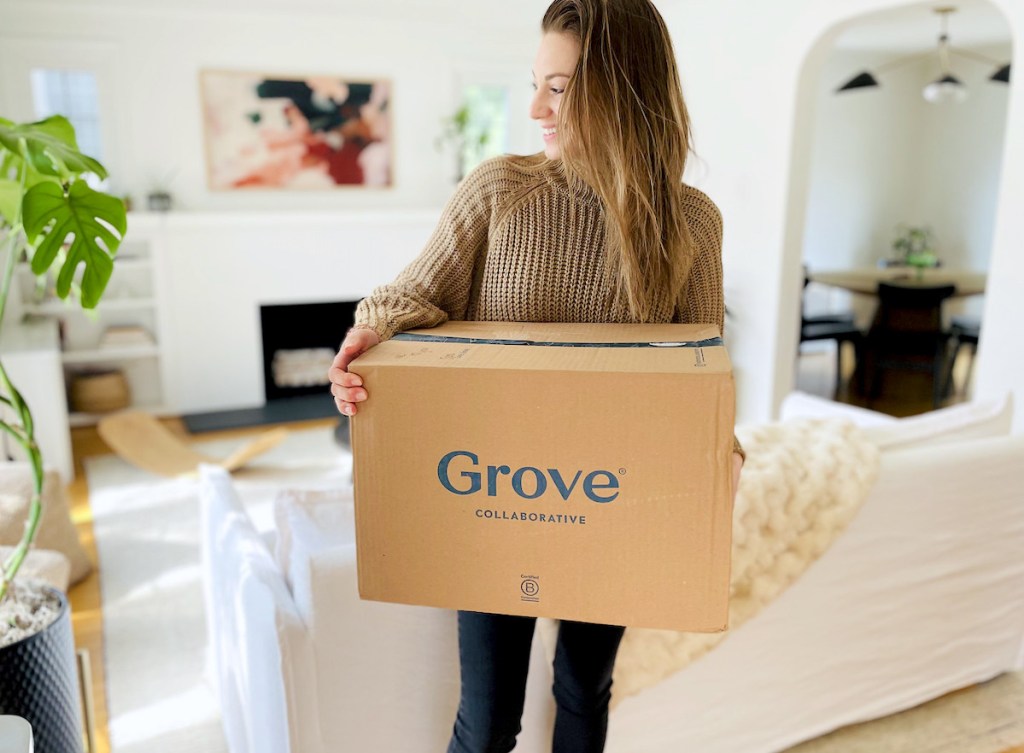 woman smiling holding grove collaborative box