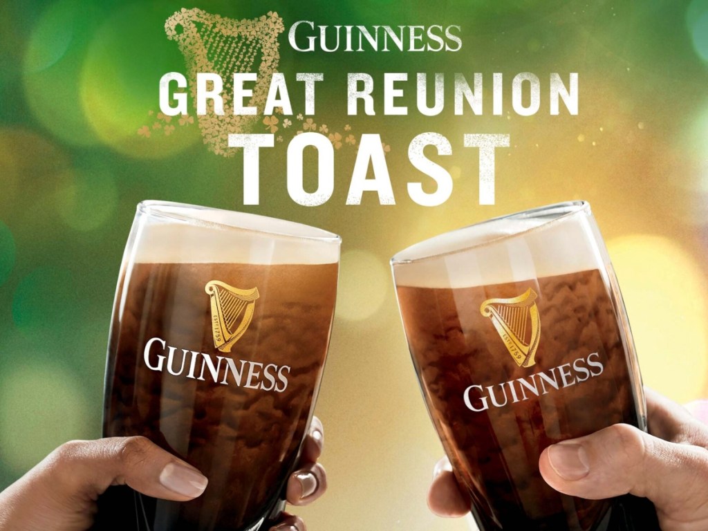 toasting two glasses of Guinness